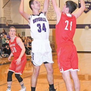 BOYCEVILLE'S POST PLAYER Cade Klefstad got this frist-half shot over Colfax defender Ed Hydukovich to falll for his only points in the game. Boyceville eventually fell at home to the Vikings, losing last Friday's contest by 48 points. —photo by Shawn DeWitt