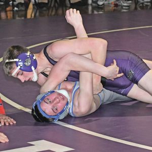 VICTORY WRAPPED UP — Bulldogs' freshman Tyler Domanen (top) is shown scoring back points against his Mondovi oppoent, Lance Crawford, in the 138-pound match of last Thursday's Dunn-St. Croxi dual in Boyceville. Dormanen scored the pin at 5:12. —photo by Shawn DeWitt