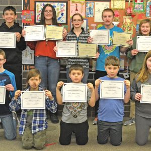 COLFAX ELEMENTARY GEOGRAPHY BEE — National Geography Bee grade level winners posed with their certificates January 15. Bottom row from left: Charlie Charbonneau (5th grade, first place grade level); Matvey Zazovskiy (5th grade, second place grade level); Andre Naranjo-Rivera (4th grade, first place); Hayden Sarauer (4th grade, second place); Shyann Rundle (6th grade, second place). Back row from left: Grayson Decker (7th grade, second place); Jeanette Hydukovich (7th grade, first place grade level, first place overall); Allison Schmitt (8th grade, first place grade level, second place overall); Mark Sonnentag (8th grade, second place grade level, third place overall); Rosie Sonnentag (6th grade, first place grade level). —photo by LeAnn R. Ralph