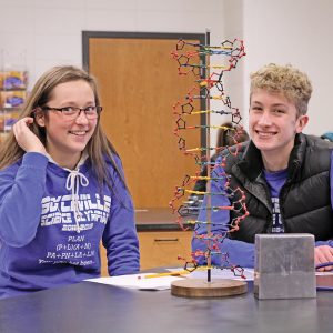 Boyceville Science Olympiad team mates Emma Bygd and Mark Timper finished up one of the many stations they had to do in the event called Designer Genes. The duo earned a gold medal. —photo by Steve Duerst