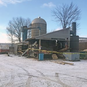 THE SAWDUST Drying Building at Woods Run Forest Products in Colfax was extensively damaged by fire Wednesday night, January 16. —photo by Shawn DeWitt