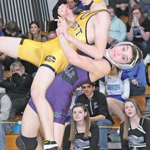 PICK AND THROW — Bulldogs' freshman wrestlers Ira Bialzik picked up and threw Ethan Duck of Cadott to the mat during the regional championship match at 126 pounds last Saturday. Bialzik won an 8-6 overtime decision against Duck to claim the regional gold. — photo by Shawn DeWitt