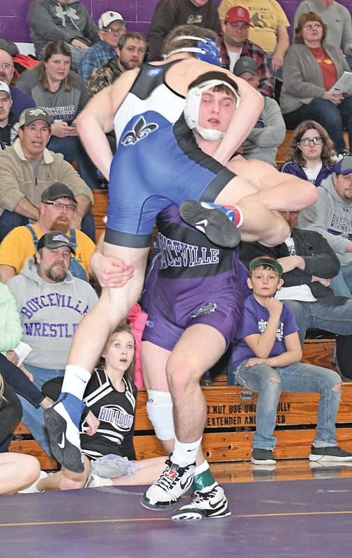 PICKED UP AND PUT DOWN — Trett Joles, Boyceville sophomore, picked up McKinley Erickson of St. Croix Falls in the 182-pound match of the WIAA Division 3 team sectional championship dual in Ladysmith Wednesday, February 13. Joles eventually put Erickson to his back to score a pin fall at 3:06. —photo by Shawn DeWitt