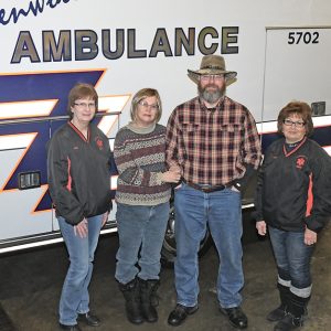 DONATION PRESENTED — Glenwood City ambulance co-directors Julie Lee (left) and Charl Draxler (right) presented Jodi and Dennis Hall with a check from a fundraiser the Glenwood City Ambulance personnel hosted on Saturday, January 26 to benefit Jodi Hall. The event featured a soup and sandwich luncheon, a bake sale and silent auction raised funds to help Jodi Hall with her medical expenses as she received treatment for pancreatic cancer. Her husband Dennis is an EMT with the Glenwood City service. The Glen Hills Lions Club, local boys scout troop and the Halls' church helped with the benefit. —photo by Shawn DeWitt