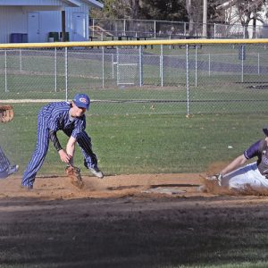 STEALING SECOND — Boyceville's Logan Knudtson successfully stole second base when the Bulldogs hosted Glenwood City last Tuesday, April 23 in a conference baseball game. The Toppers Bryce Wickman (center) fielded the wide threw on the play while teammated Gavin Janson (left) backed up the toss. Boyceville went on to win the game 10-2. —photo by Shawn DeWitt