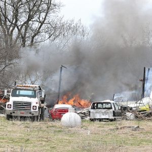 FIRE FROM A BURNING TRASH BARREL spread to grass and into a shed about the size of a double size garage and destroyed the structure. The fire on Sunday afternoon, April 28, was on the Andrew and Kim Ersland property at 2453 170th Avenue in Emerald Township. Using a garden hose, the owner was able to keep the fire from spreading into another garage until the fire department arrived. Glenwood City firefighters were on the scene for almost two hours and they were assisted with equipment from United Fire’s Woodville station and Boyceville Fire Department. —photo by Shawn DeWitt