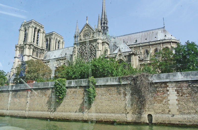 NOTRE DAME CATHEDRAL in Paris as it looked on August 7, 2018 when this picture was taken from our tour boat on the Seine River. The 856-year-old Cathedral received heavy damage by a large fire on Monday, April 15th. —photo by Carlton DeWitt