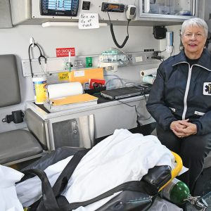 Paula DeWitt in patient area of ambulance