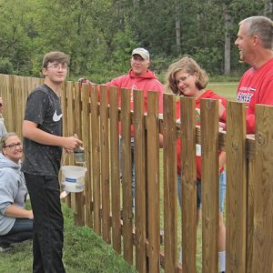 God's Work Our Hands fence photo