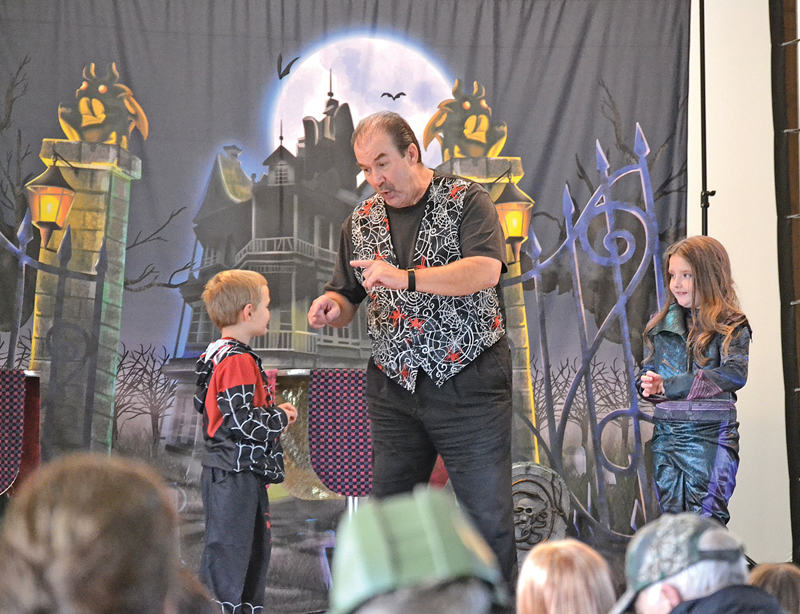 Halloween party Colfax library Magic Bob assistants