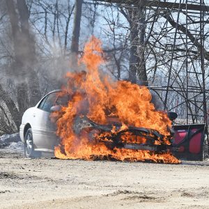 CONSUMED BY FIRE — The Glenwood City Fire Department was called to 1083 Rustic Road in the Town of Springfield shortly before noon last Wednesday, April 1 for a vehicle on fire. Firefighters arrived on scene to find the vehicle, a 2003 Buick LaSabre, fully engulfed in flames and were quickly able to extinguish the fire but the car was a total loss. The vehicle was owned by Shane and Cherri Peterson and their son Kyle Peterson was attempting to jump start the car when it caught fire. —photo by Shawn DeWitt