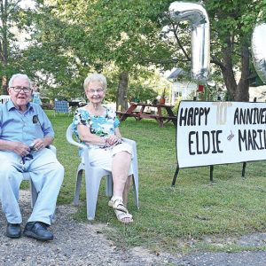 70 YEARS OF WEDDED BLISS — Family members organized and held a 70th Wedding Annivesary drive-by celebration for Eldon (Eldie) and Marilyn Wheeler (pictured above) on Wednesday evening, September 2. The event drew dozens of vehicles including Boyceville fire trucks and ambulance, Dunn County Sheriff’s Patrol cars, private cars and trucks and some UTV’s. The line of vehicles traveled down the alley behind the Stevens’ home in Wheeler. —photo by Shawn DeWitt