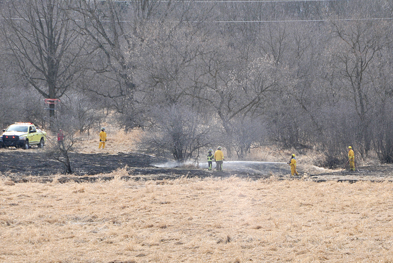 FIRE CHIEF HAS GRASS FIRE—Glenwood City Fire Chief Greg Holden was burning a brush pile at his home along County Highway W in Downing Sunday afternoon and the fire got away from him and spread into a tall grassy area. It was quickly extinguished by local firefighters. —photo by Shawn DeWitt