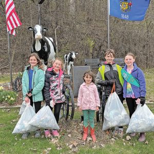 GC Jr Girl Scouts clean trash along Tiffany Creek