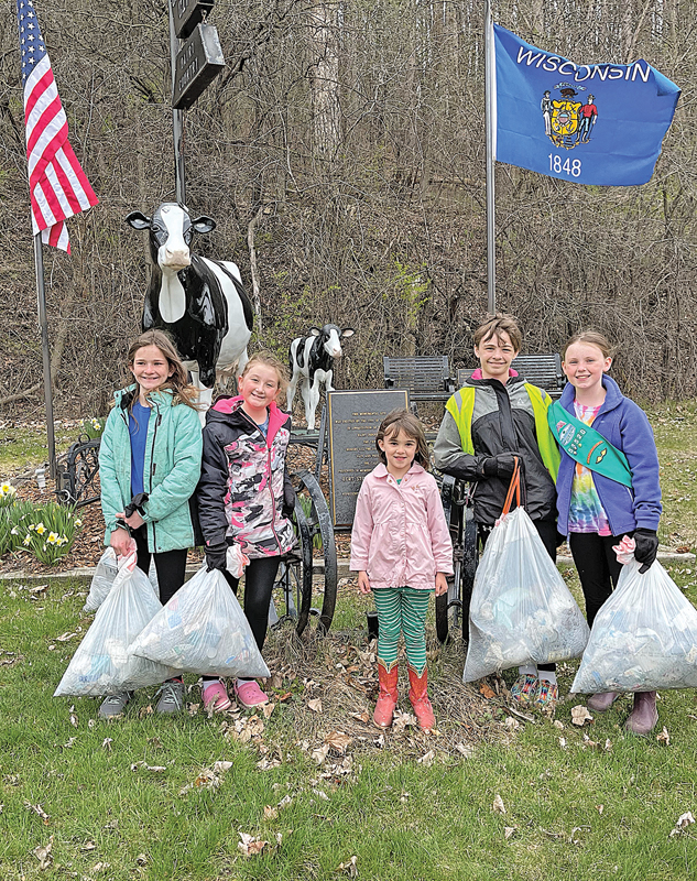 GC Jr Girl Scouts clean trash along Tiffany Creek