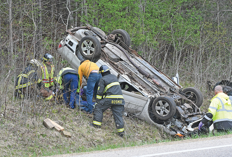 ONE PERSON WAS TRAPPED in this vehicle that rolled over after leaving the roadway of Highway 128 south of Glenwood City near Glen Meadows Lane early Monday morning, May 3rd. According to the Glenwood City Police Department, the driver of the vehicle was 53 year-old Anthony Brown of 405 Maple Street, Glenwood City and his passenger was Kayla Brown, 30. The driver was issued three citations, one for inattentive driving, no driver’s license and no insurance. Assisting at the scene was the Glenwood City Ambulance, Fire Department, St. Croix County Sheriff’s Department and Wisconsin State Patrol. —photo by Shawn DeWitt