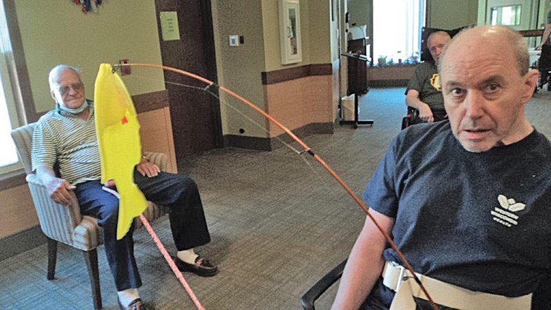 IT’S A WHOPPER — Richard looked on as Dave landed a big fish. By the yellow color, it must be a sunny! —photo submitted