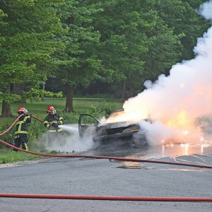 THIS PONATIC WAS DESTROYED by fire on Wednesday, July 21. The car started on fire while Jared Husby was driving it at near the intersection of 130th Avenue and County Highway D in Emerald Township. —photo by Shawn DeWitt