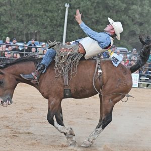 LEANING WAY back was Bobby Reynolds of Oakland, Iowa during his ride in Saturday's bareback riding competition at the 2021 St. Croix Valley PRCA Rodeo in Glenwood City. —photo by Shawn DeWitt