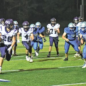 GONE — Boyceville junior running back Bash Nielson (#26) took off for the end zone on this 29-yard run to pay dirt in the third quarter. Nielson’s touchdown was the Bulldogs final score in their 36-0 raod whitewashing of the Cameron Comets August 27. —photo by Shawn DeWitt