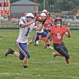 INTERCEPTION — Glenwood City senior Brady McCarthy (#1) stepped in front of Spencer/Columbus Catholic’s Brock Bennington (#5) to intercept this pass during the second quarter of Glenwood City’s 2021 season opening football contest in Spencer last Thursday, August 19. After taking a quick 7-0 lead, turnovers hurt the Hilltoppers who lost 51-28. —photo by Shawn DeWitt