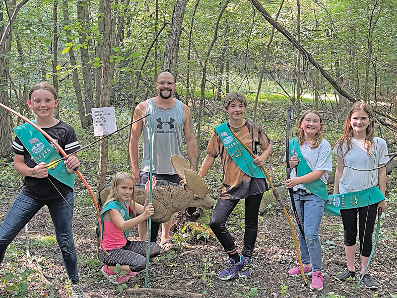 Local Glenwood City Bait and Bow shop owner Sean Lybert shared his archery expertise with the local Girl Scout Troop on his new 3D target range, they all hit targets by the end of the lesson. —photo submitted