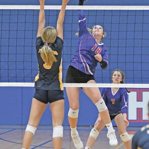 SMASHING DOWN this winner was Glenwood City junior Arianna DeSmith (#18) during a home match against New Auburn last Thursday, August 26. The Hilltoppers hosted a six-team tournament. —photo by Shawn DeWitt