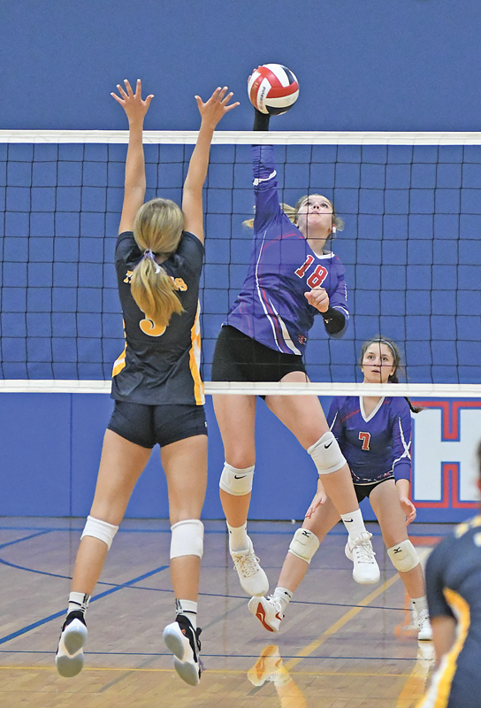 SMASHING DOWN this winner was Glenwood City junior Arianna DeSmith (#18) during a home match against New Auburn last Thursday, August 26. The Hilltoppers hosted a six-team tournament. —photo by Shawn DeWitt