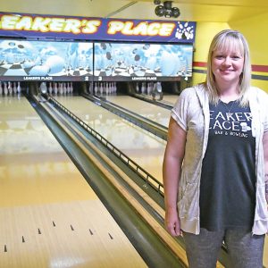 LEAKER’S PLACE UNDER NEW OWNERSHIP — Tasha Klein (pictured above) recently stood in front of the four bowling Lanes at Leaker’s Place in Glenwood City. Klein, along with her husband Joel, recently purchased the well-known Glenwood City business from longtime owners and operators Larry “Leaker” and Cheryl Standaert. The Kleins took over operations of the bowling center and bar on July 1. The couple, who intend to keep the “Leaker’s Place” moniker, have already remodeled the bar-side of the business. —photo by Shawn DeWitt