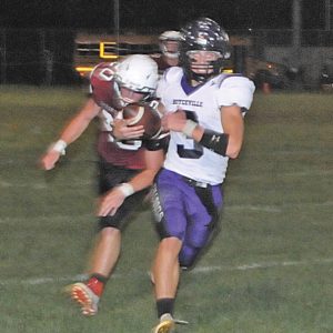 Senior quarterback Ira Bialzik headed for the sideline while being chased by a Sporing Valley defender in the second half of Bocyeville’s road game in Spring Valley September 10. Bialzik finished with just eight yards rushing but was 6-for-9 passing for 101 yards in a 35-6 loss. —photo by Joel DeWitt