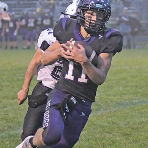 SIX-POINT RECEPTION — Senior receiver Jacob Granley cradled this pass from Ira Bialzik in the first quarter of Boyceville’s home conference opener versus Cadott last Friday evening, September 3. Granley scored a touchdown on the 26-yard pass play to help the Bulldogs defeat the Hornets 50-22. —photo by Shawn DeWitt