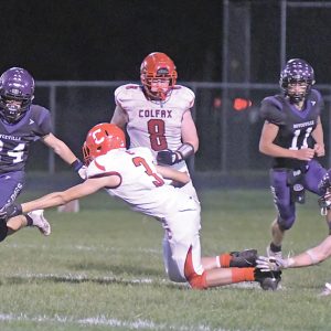 TOUCHDOWN RUN — Boyceville sophomore Braden Roemhild (#24) adeptly ran past the tackle attempt of a Colfax defender and proceeded to weave his way to a 45-yard touchdown in the second quarter of the Bulldogs’ 51-0 home shellacking of the Vikings September 17. Roemhild finished with 93 rushing yards to lead the Bulldogs ground attack which piled up 354 yards. —photo by Shawn DeWitt