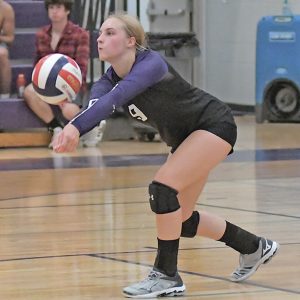 SERVE RECEIVED — Senior Lacota Brown, right, is shown receiving a serve during the Bulldogs home volleyball match with Durand September 16. —photo by Shawn DeWitt