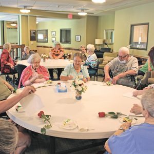RETIREMENT CELEBRATION — Doris enjoyed cake with the residents during her retirement celebration September 17. —photo by Missy Klatt.