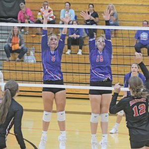 GLENWOOD CITY’S Amalia Draxler (left) and Arianna DeSmith attempted to block this shot during a volleyball match in Elk Mound. —photo by Shawn DeWitt