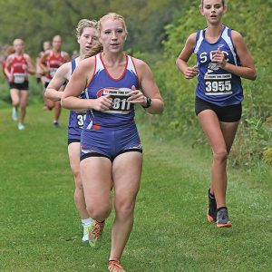 GLENWOOD CITY senior Kendall Schutz neared the two-mile mark in a cross country race at St. Croix Central September 2. Schutz, who ran a 22:25.1, finished tenth for the Lady Toppers who placed fifth as a team. —photo by Shawn DeWitt