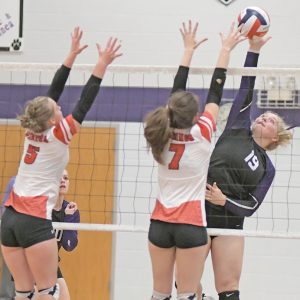 NET PLAY — Boyceville senior Libby Bygd (#19) looked to hit the volleyball past the block attempt of Colfax’s Madison Barstad during a September 28 match in Boyceville. —photo by Shawn DeWitt