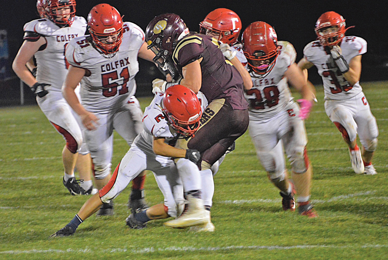 DEFENSIVE back Theo Hovde of Colfax brought down a Laker runner in the game played October 1 in Turtle Lake. —photo by Marlys Kruger