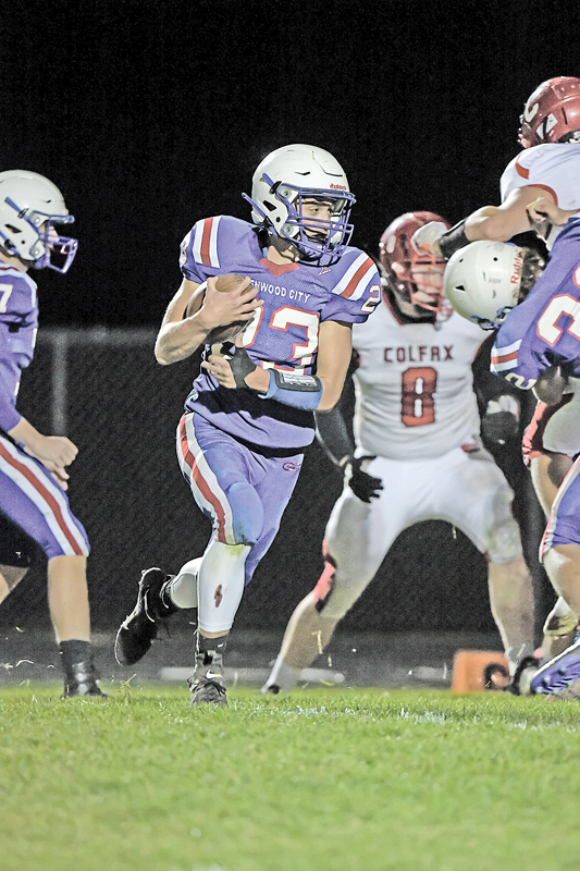 HEADED FOR PAYDIRT — Glenwood City senior Justin Moe (#23) is shown running toward the endzone for one of his two touchdowns runs against the Colfax Vikings in last Friday evening's home football game. Moe finished with eight rushes for 64 yards as the Hilltoppers shutout the Vikings 55-0 to win their annual Homecoming contest. —photo by Jacob Maes Photography