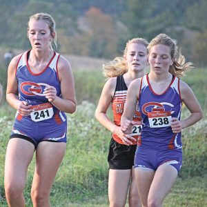 THE HILLTOPPERS’ Libby Wagner (left) and Savanna Millermon (right) are shown running the course at the Spring Valley Cross Country Invitational held September 30. Millermon finished 53rd while Wagner took 56th. —photo by Missy Klatt
