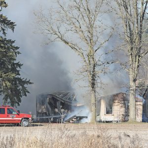 FIRE DESTROYED this mobile home located on Dunn County Highway V, about a mile north of Highway 64 on Tuesday, November 23. Fire fighters from Boyceville, Glenwood City and Menomonie were on the scene. Other details about the fire were not available at press time. —photo by Shawn DeWitt
