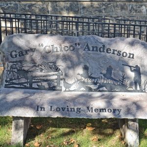 MEMORIAL BENCH IN TOWER PARK — Woods Run Forest Products has installed a bench in memory of Colfax resident Gary Anderson at Tower Park in Colfax next to the Colfax Municipal Building. Anderson died May 31, 2021. He had worked at Woods Run for 33 years before retiring in 2019. —photo by LeAnn R. Ralph
