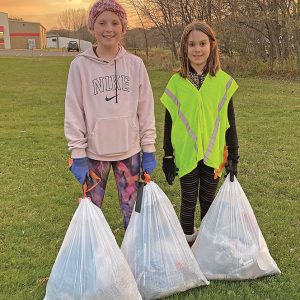 LOCAL Glenwood City Elementary 5th graders Abby Mewis (left) and Izzy Grutt spent time Friday evening and Saturday morning, November 5 and 6 picking up trash in town. The pair filled six and a half bags. —photo submitted