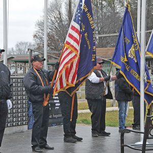A LARGE GROUP OF PEOPLE braved the cold windy afternoon of Thursday, November 18th to attend the dedication at the Wheeler Veterans Memorial at the Village Ball Park. Members of veteran groups stood at the Memorial during the ceremony where Brian Lorenz gave a background of the project and VFW Post 10424 Commander Randall Weiss conducted the Dedication Ceremony were concluded by a 21-gun salute with fireworks. —photo by Carlton DeWitt