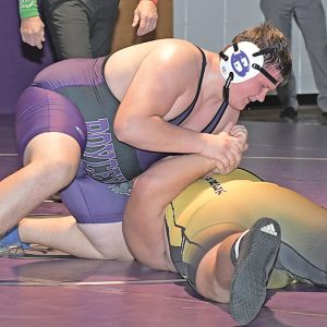BOYCEVILLE heavyweight Keegan Plemon (top) prepared to turn Cadott’s Kane Mengel to his back for a pin in the 285-pound match during last Thursday’s dual in Boyceville. The Hornets won 57-18. —photo by Shawn DeWitt