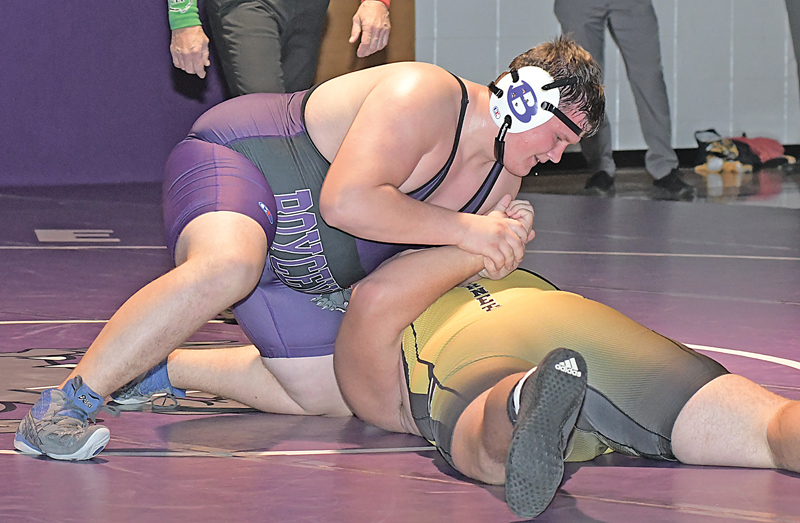 BOYCEVILLE heavyweight Keegan Plemon (top) prepared to turn Cadott’s Kane Mengel to his back for a pin in the 285-pound match during last Thursday’s dual in Boyceville. The Hornets won 57-18. —photo by Shawn DeWitt