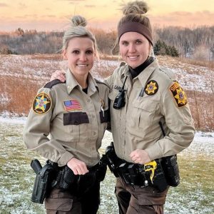 Stephanie Caress, left, graduated from the Chippewa Valley Technical College Law Enforcement Academy Thursday, Dec. 16. She will continue her career with the St. Croix County Sheriff’s office as a patrol deputy. Her sister, Samantha Caress, 28, is a patrol deputy with Dunn County Sheriff’s office, and graduated from CVTC’s criminal justice program and the law enforcement academy in 2020. —photo submitted