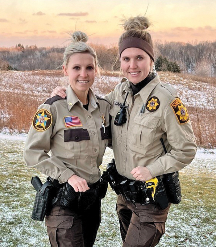 Stephanie Caress, left, graduated from the Chippewa Valley Technical College Law Enforcement Academy Thursday, Dec. 16. She will continue her career with the St. Croix County Sheriff’s office as a patrol deputy. Her sister, Samantha Caress, 28, is a patrol deputy with Dunn County Sheriff’s office, and graduated from CVTC’s criminal justice program and the law enforcement academy in 2020. —photo submitted