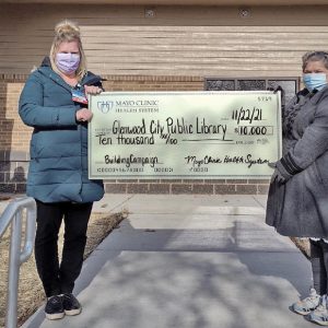 MAYO CLINIC HEALTH SYSTEM presented a large donation to the Glenwood City Library. In the photo above, Mayo Clinic R.N. Nurse Manager Heather Logslett (a Glenwood City native), left front, presented a check for $10,000 to Glenwood City Library Director Rochel Karlson, right front, during the November 23 ceremony that was held in front of Glenwood City’s nearly-completed, mutli-use municipal building located on West Oak Street. Library board member Nicole Langman (back left) and Library board president Julie Anderson (back right) also participated in the check presentation. The Mayo grant helped the library reach its fundraising goal of $70,000 which will go toward the purchase of furnishings at its new location. “Growing up here in Glenwood City, I enjoyed visiting the Library. This is a great way to advance and improve the Library’s technology accessibility. I am so proud to work for Mayo Health Systems, and am grateful for the ways they give back to the community.” said Heather Logslett, R.N. Nurse Manager Mayo Clinic Health System at Red Cedar, during the presentation. —photo submitted