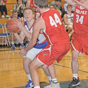 GLENWOOD CITY senior Brendan Booth (#33) looked to get a shot off during late action in the Toppers home game versus Colfax on December 7. —photo by Shawn DeWitt